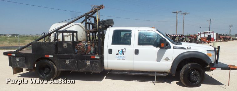 image for item FL9394 2014 Ford F550 Super Duty Crew Cab flatbed truck