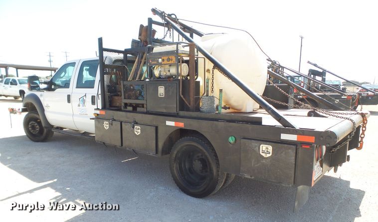 image for item FL9394 2014 Ford F550 Super Duty Crew Cab flatbed truck