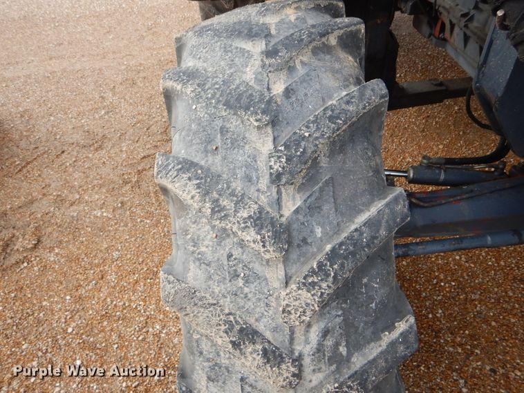 image for item DH6070 2000 New Holland TM115 MFWD tractor