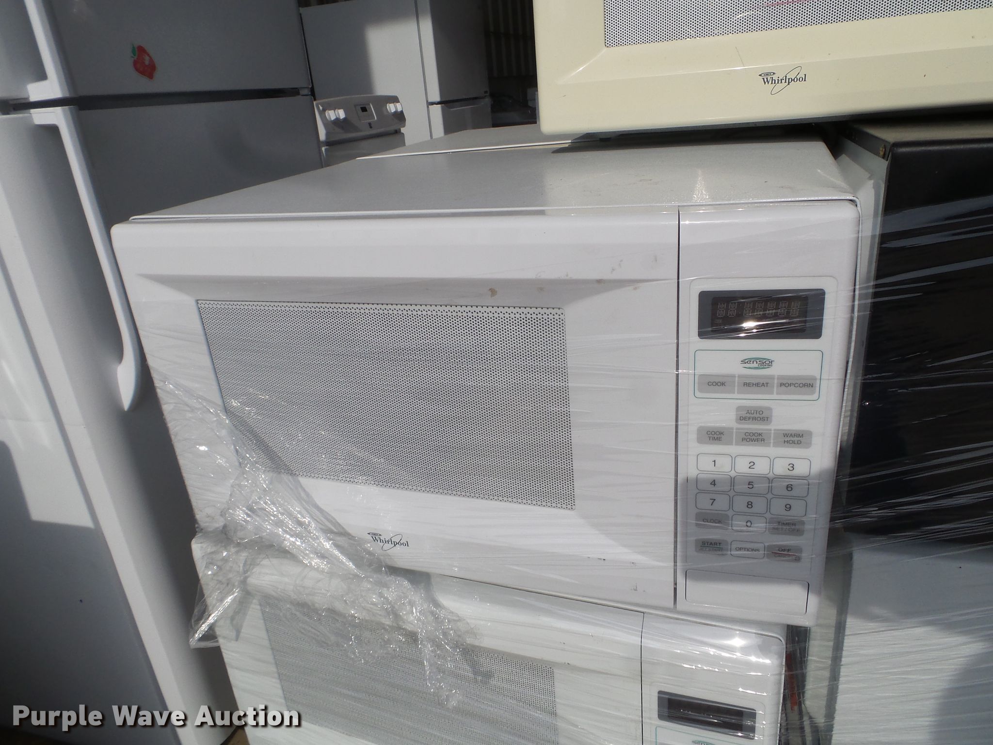 (20) Whirlpool microwaves in Des Moines, IA Item FM9395 sold Purple