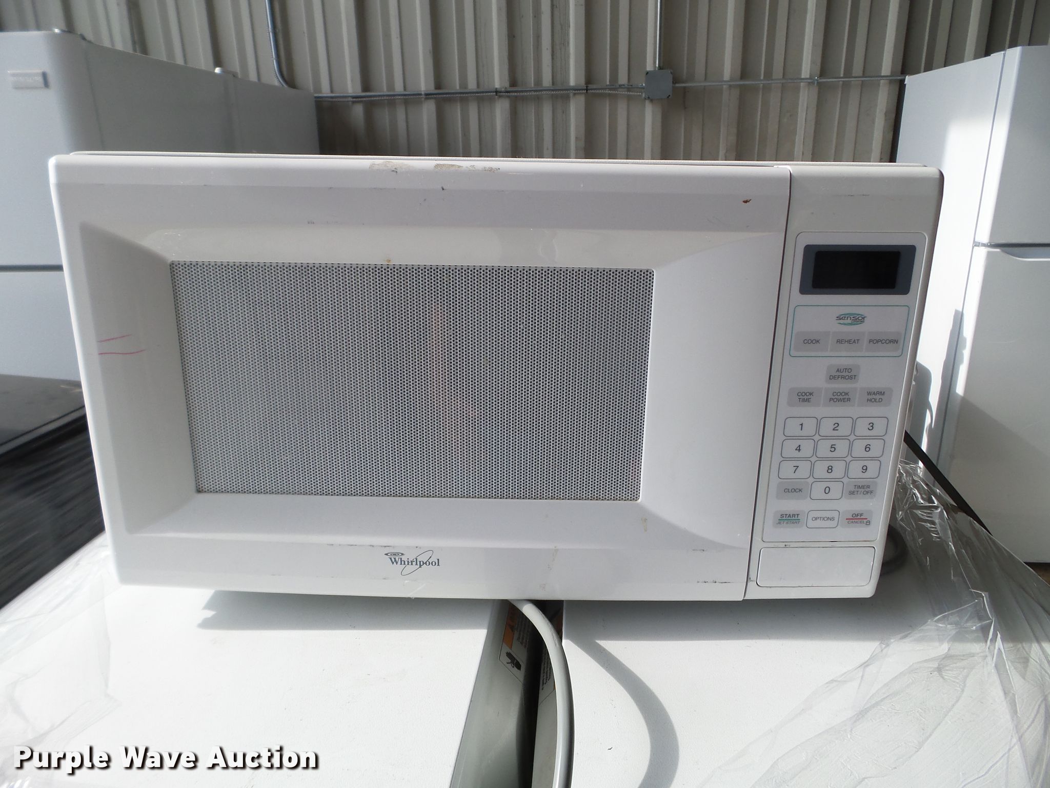 (14) Whirlpool microwaves in Des Moines, IA Item FM9396 sold Purple