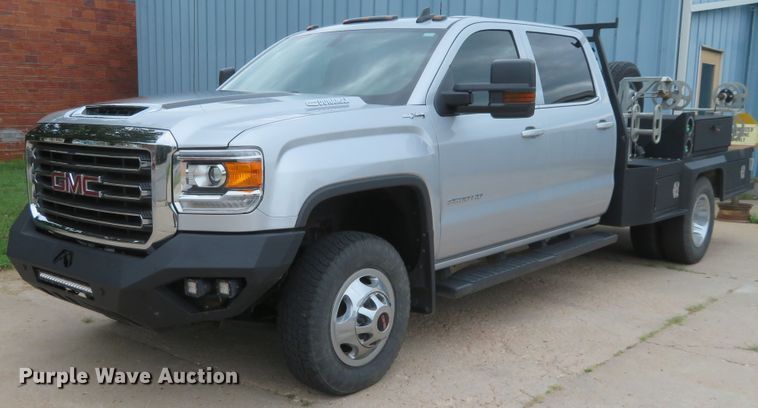 image for item G1937 2017 GMC Sierra 3500HD Crew Cab flatbed pickup truck