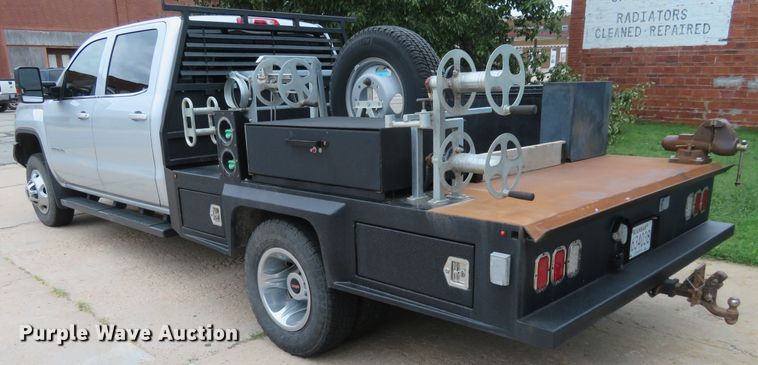 image for item G1937 2017 GMC Sierra 3500HD Crew Cab flatbed pickup truck