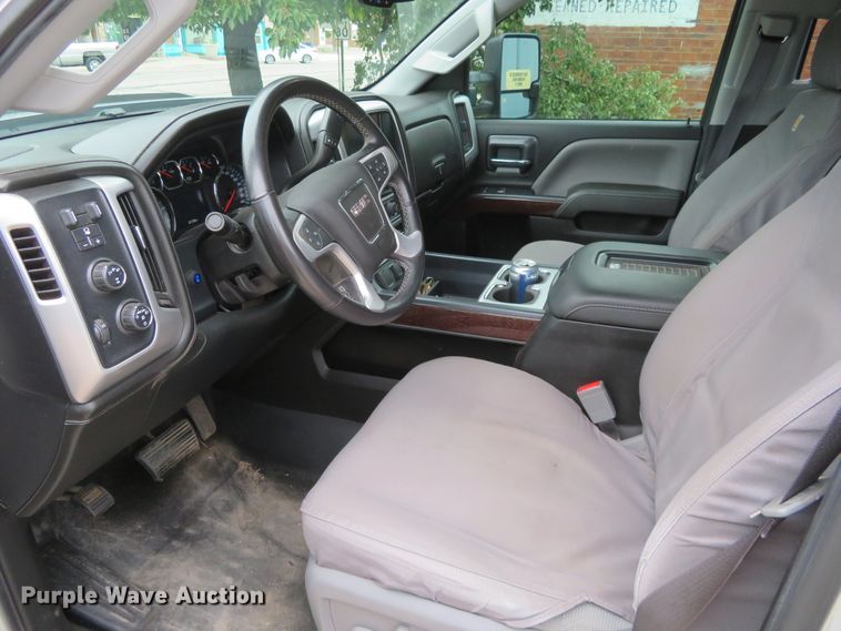 image for item G1937 2017 GMC Sierra 3500HD Crew Cab flatbed pickup truck