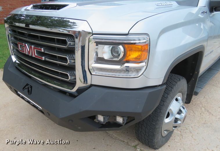 image for item G1937 2017 GMC Sierra 3500HD Crew Cab flatbed pickup truck