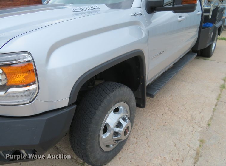 image for item G1937 2017 GMC Sierra 3500HD Crew Cab flatbed pickup truck