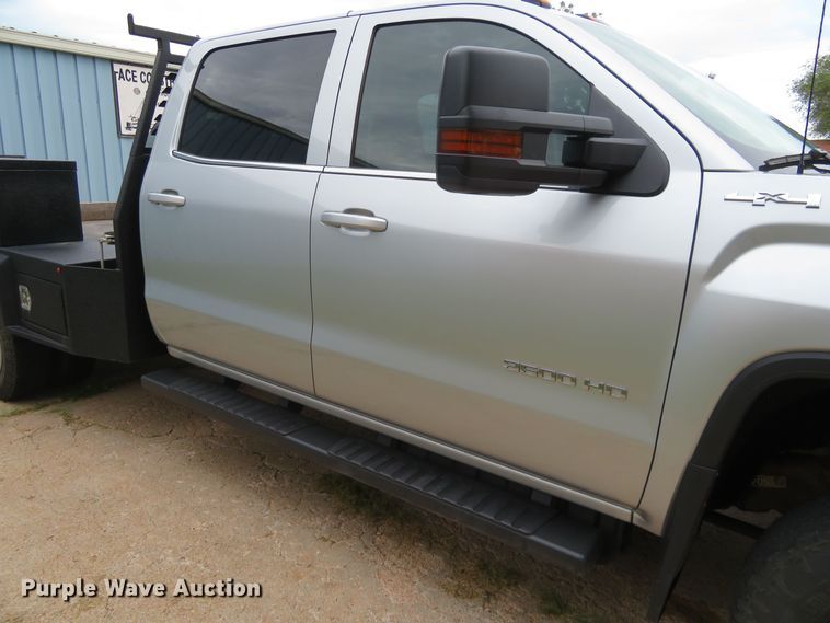 image for item G1937 2017 GMC Sierra 3500HD Crew Cab flatbed pickup truck