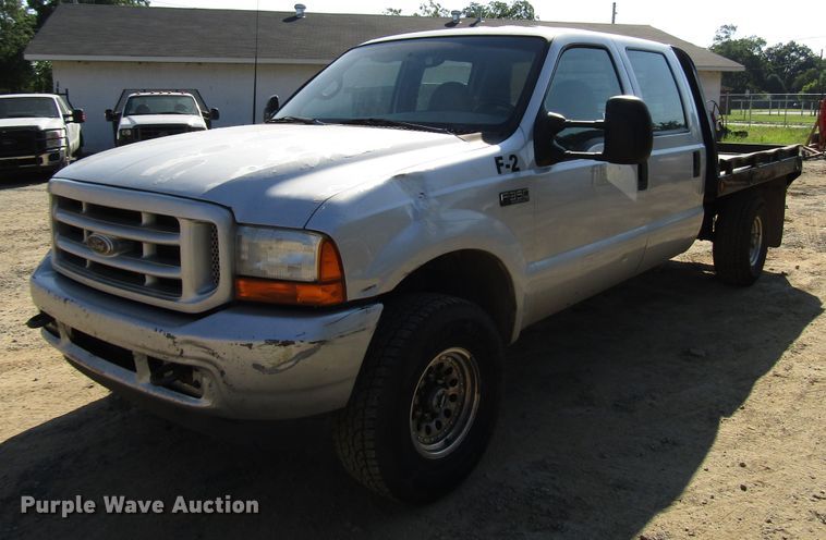 image for item DG1345 2001 Ford F350 Super Duty Crew Cab flatbed pickup truck