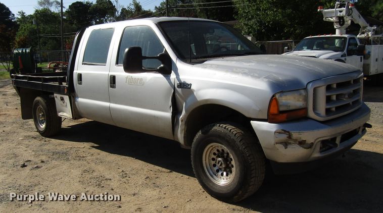 image for item DG1345 2001 Ford F350 Super Duty Crew Cab flatbed pickup truck