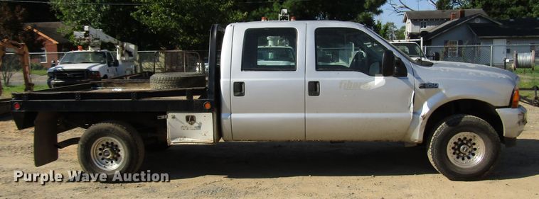image for item DG1345 2001 Ford F350 Super Duty Crew Cab flatbed pickup truck