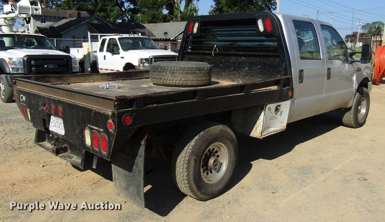 image for item DG1345 2001 Ford F350 Super Duty Crew Cab flatbed pickup truck