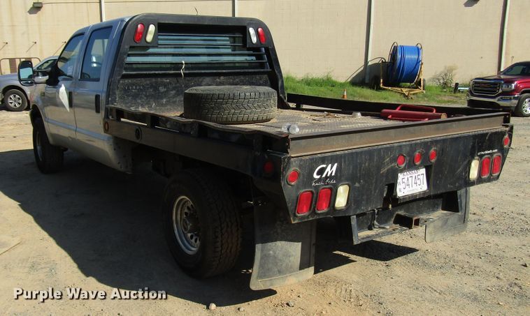 image for item DG1345 2001 Ford F350 Super Duty Crew Cab flatbed pickup truck