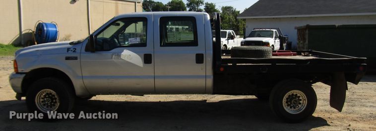 image for item DG1345 2001 Ford F350 Super Duty Crew Cab flatbed pickup truck