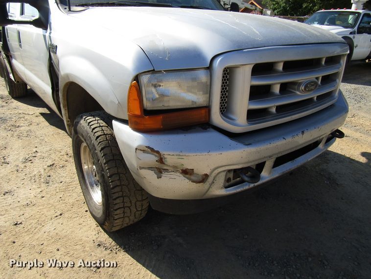 image for item DG1345 2001 Ford F350 Super Duty Crew Cab flatbed pickup truck