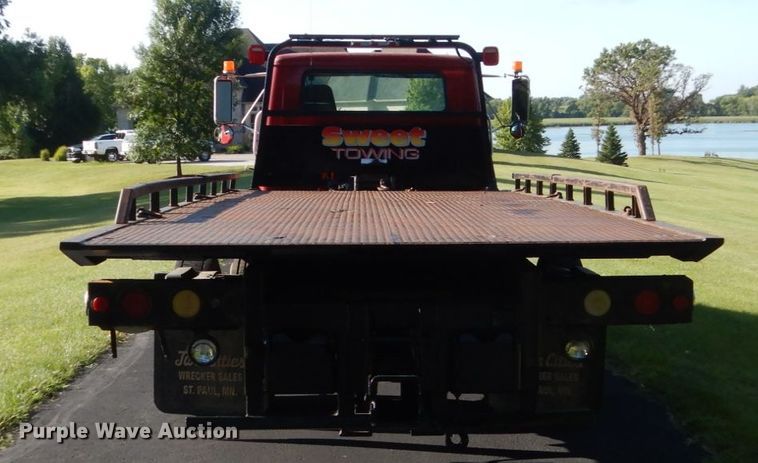 image for item FU9415 1999 International 4700 rollback truck