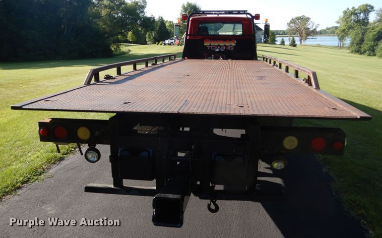 image for item FU9415 1999 International 4700 rollback truck