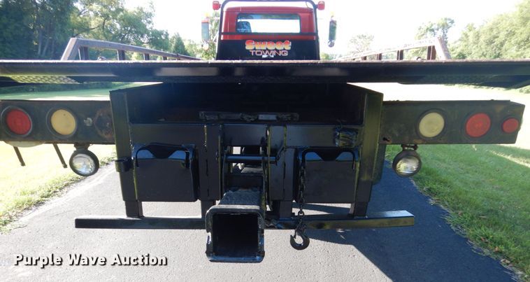 image for item FU9415 1999 International 4700 rollback truck