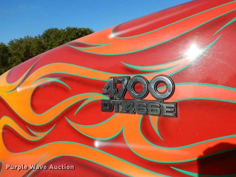 image for item FU9415 1999 International 4700 rollback truck