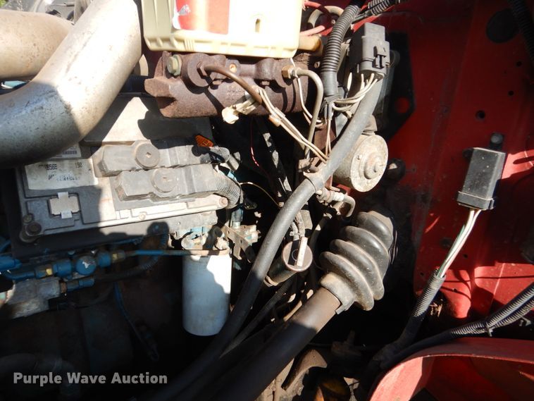 image for item FU9415 1999 International 4700 rollback truck