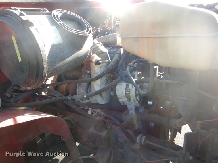 image for item FU9415 1999 International 4700 rollback truck