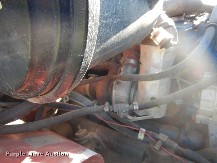 image for item FU9415 1999 International 4700 rollback truck