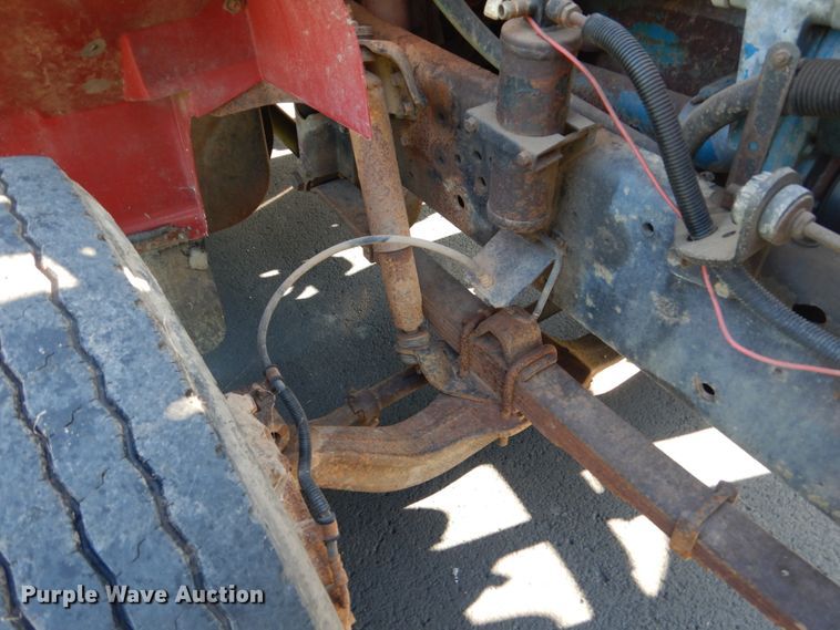 image for item FU9415 1999 International 4700 rollback truck