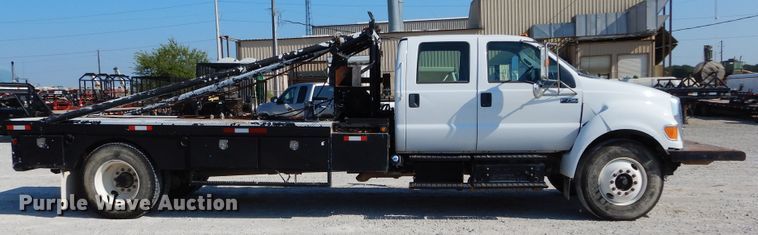 image for item DH3567 2012 Ford F750 Super Duty flatbed winch truck