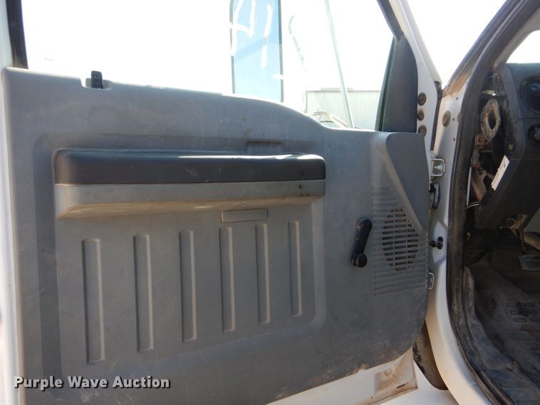 image for item DH3567 2012 Ford F750 Super Duty flatbed winch truck