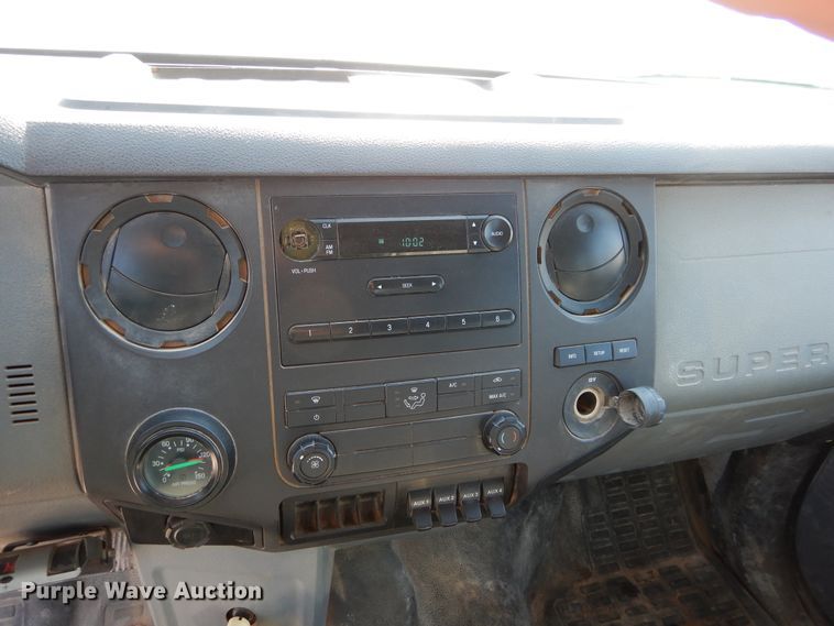 image for item DH3567 2012 Ford F750 Super Duty flatbed winch truck