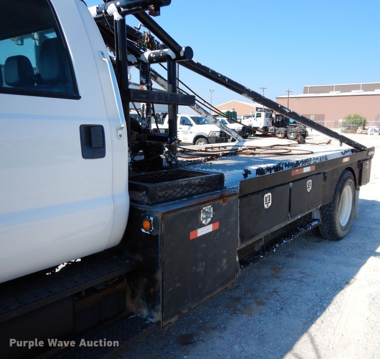 image for item DH3567 2012 Ford F750 Super Duty flatbed winch truck