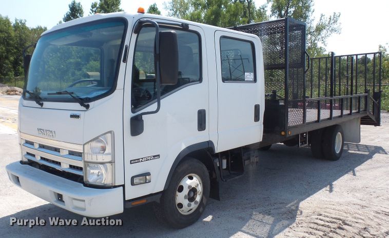 image for item DE2379 2008 Isuzu NPR-HD Crew Cab flatbed truck