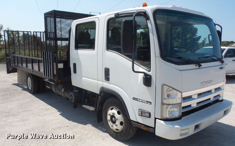 image for item DE2379 2008 Isuzu NPR-HD Crew Cab flatbed truck