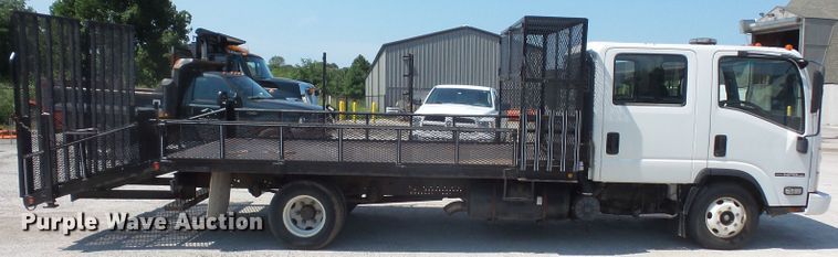 image for item DE2379 2008 Isuzu NPR-HD Crew Cab flatbed truck