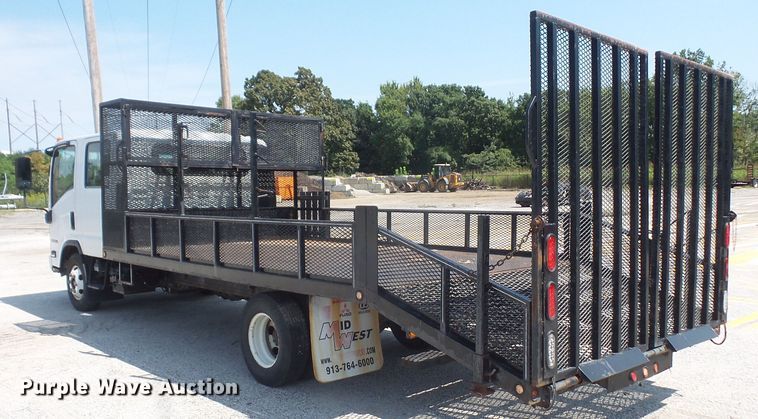 image for item DE2379 2008 Isuzu NPR-HD Crew Cab flatbed truck