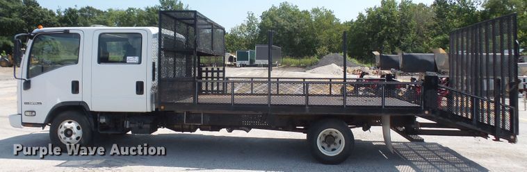 image for item DE2379 2008 Isuzu NPR-HD Crew Cab flatbed truck