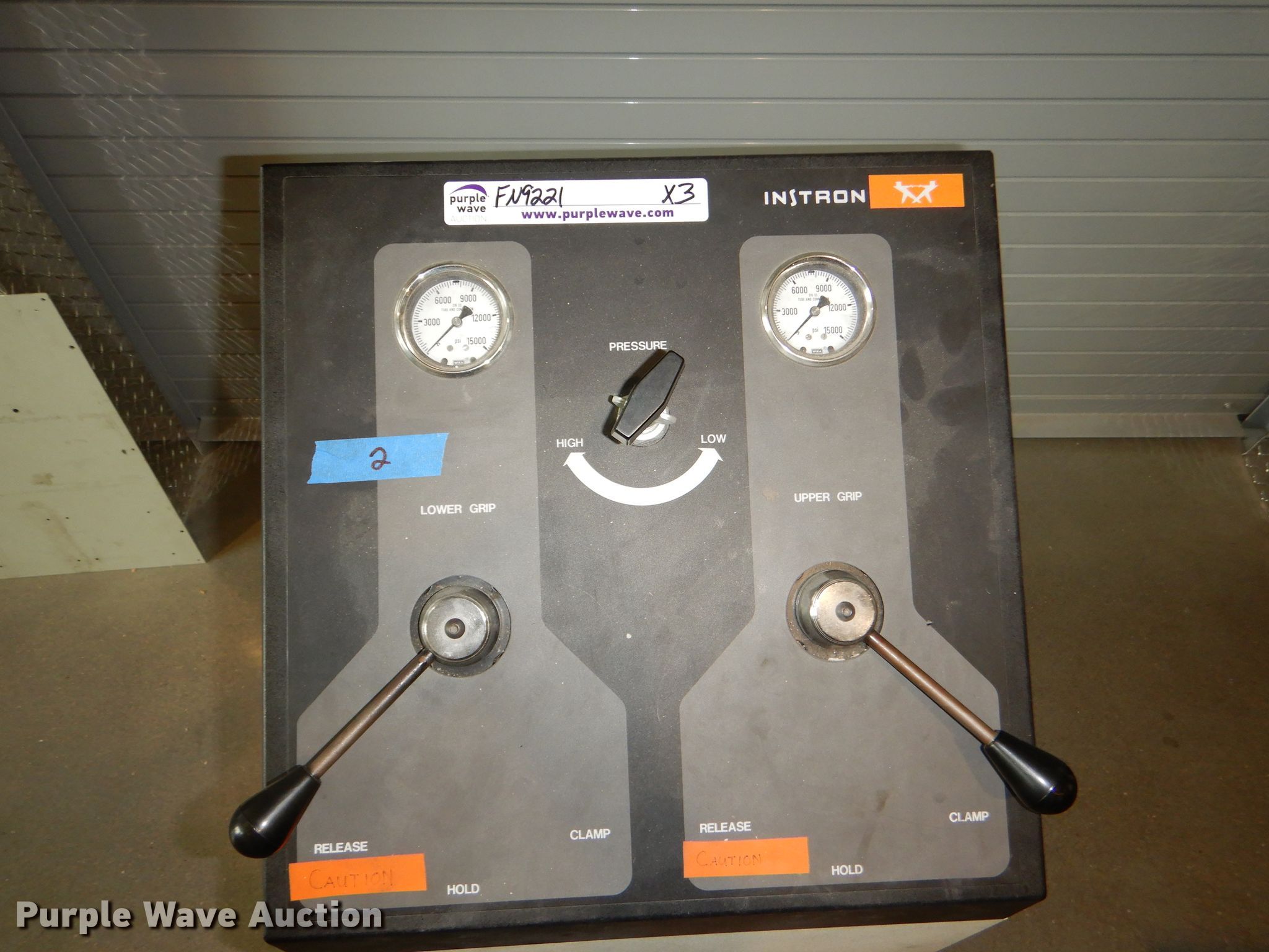 (2) Instron grips in Manhattan, KS | Item FN9221 sold | Purple Wave