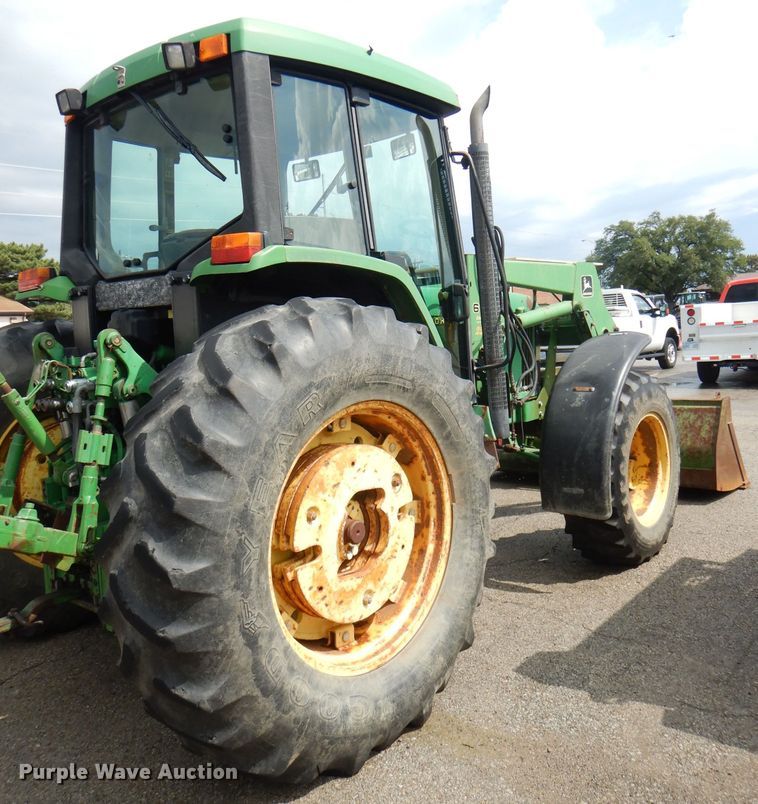 image for item DG4985 1999 John Deere 6310 MFWD tractor