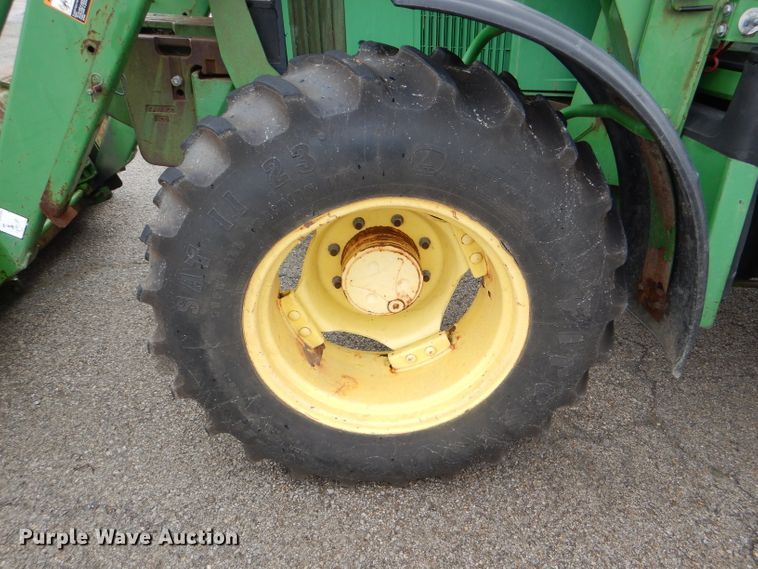 image for item DG4985 1999 John Deere 6310 MFWD tractor