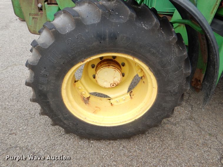 image for item DG4985 1999 John Deere 6310 MFWD tractor