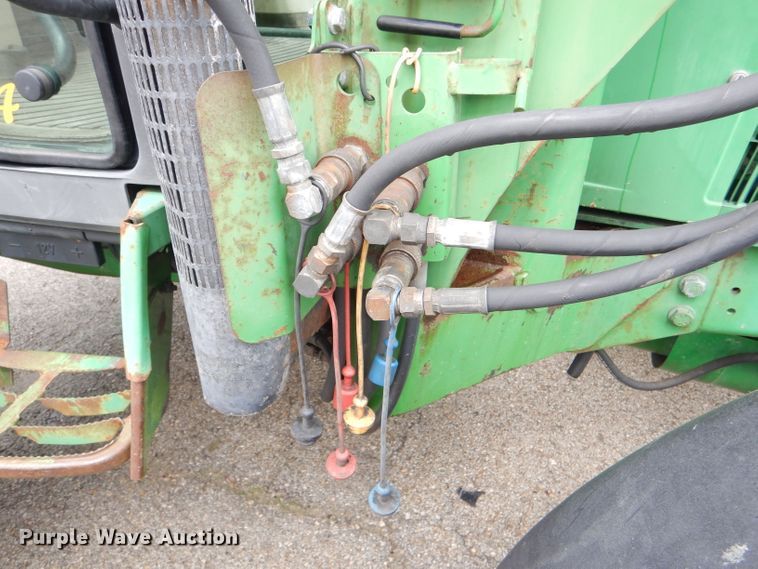 image for item DG4985 1999 John Deere 6310 MFWD tractor