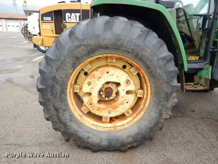 image for item DG4985 1999 John Deere 6310 MFWD tractor