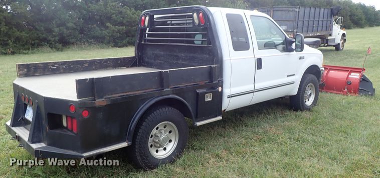 image for item DB7739 1999 Ford F250 Super Duty SuperCab flatbed pickup truck