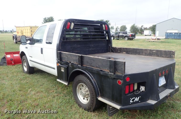 image for item DB7739 1999 Ford F250 Super Duty SuperCab flatbed pickup truck