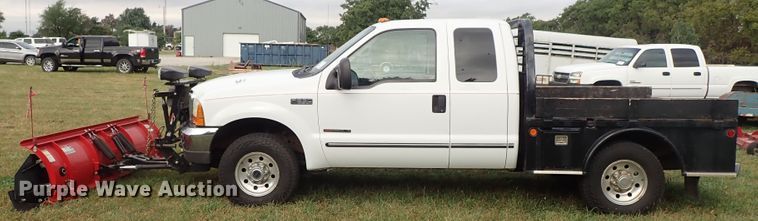 image for item DB7739 1999 Ford F250 Super Duty SuperCab flatbed pickup truck