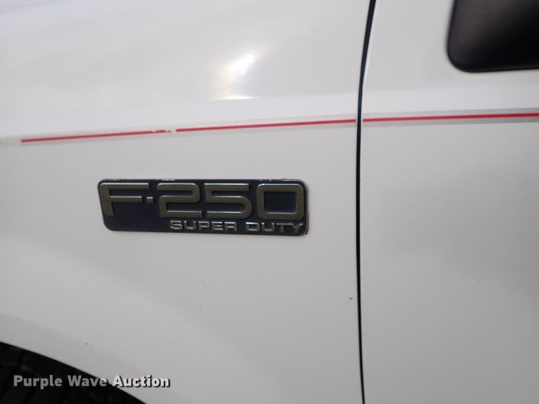 image for item DB7739 1999 Ford F250 Super Duty SuperCab flatbed pickup truck