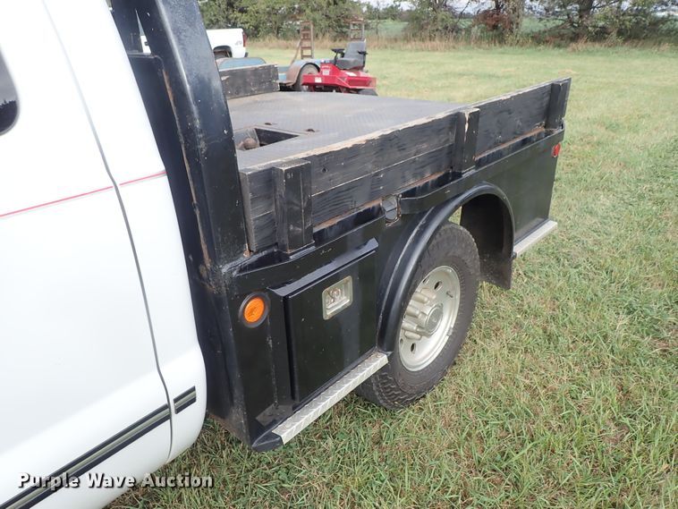 image for item DB7739 1999 Ford F250 Super Duty SuperCab flatbed pickup truck