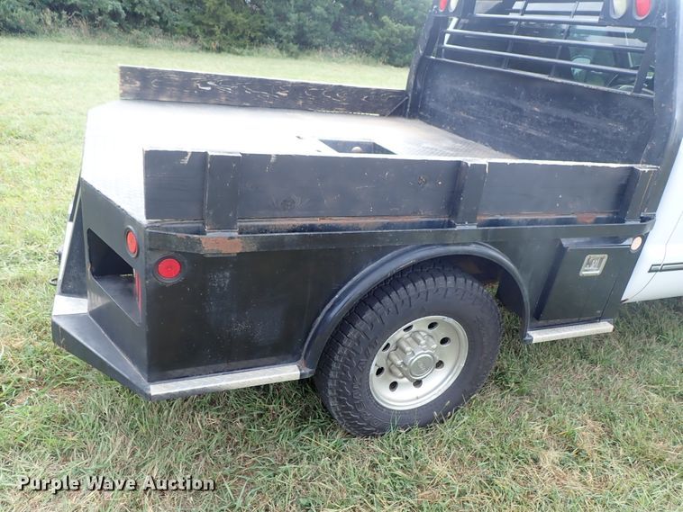 image for item DB7739 1999 Ford F250 Super Duty SuperCab flatbed pickup truck