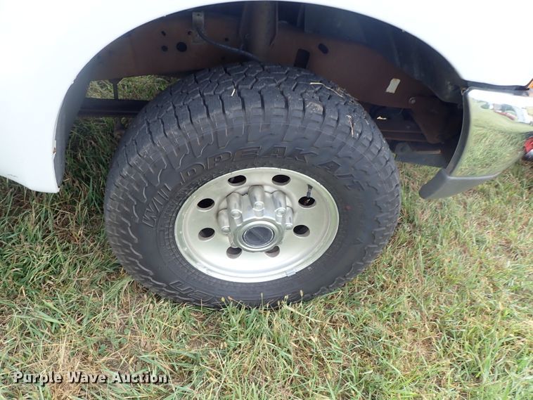 image for item DB7739 1999 Ford F250 Super Duty SuperCab flatbed pickup truck