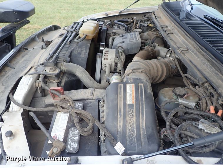 image for item DB7739 1999 Ford F250 Super Duty SuperCab flatbed pickup truck