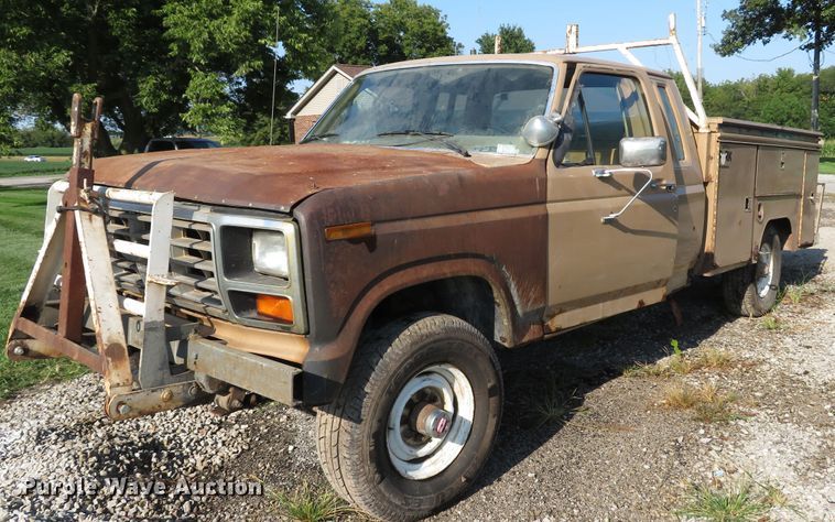 image for item DH1557 1984 Ford F250 Ext. Cab utility bed pickup truck